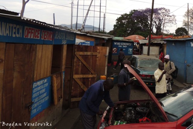 Mechanic next to 'Rasta Barber Shop' in Blantyre