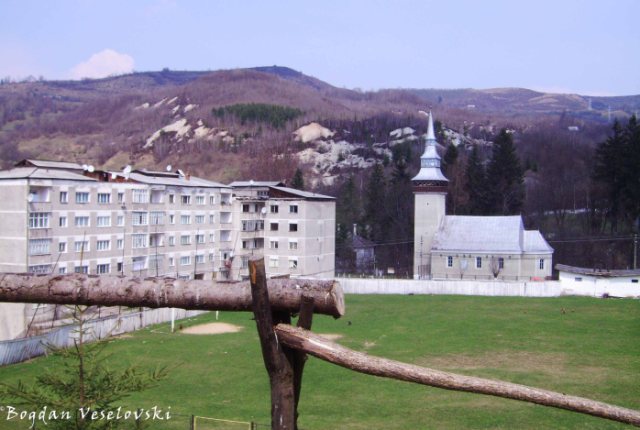 Apartment blocks, ground and church in Roșia Montană