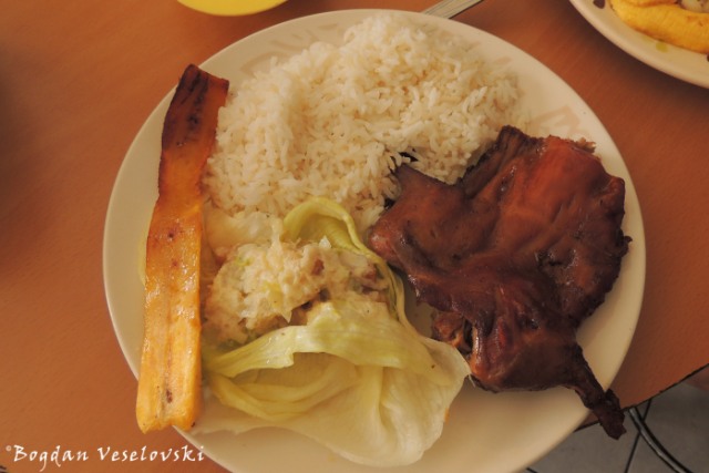Cuy a la brasa - cuarto de cuy, arroz, salsa de mani, lechuga, maduro (Guineea pig with peanut sauce, rice, lettuce, banana)